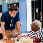 PACE social worker talking with participant 