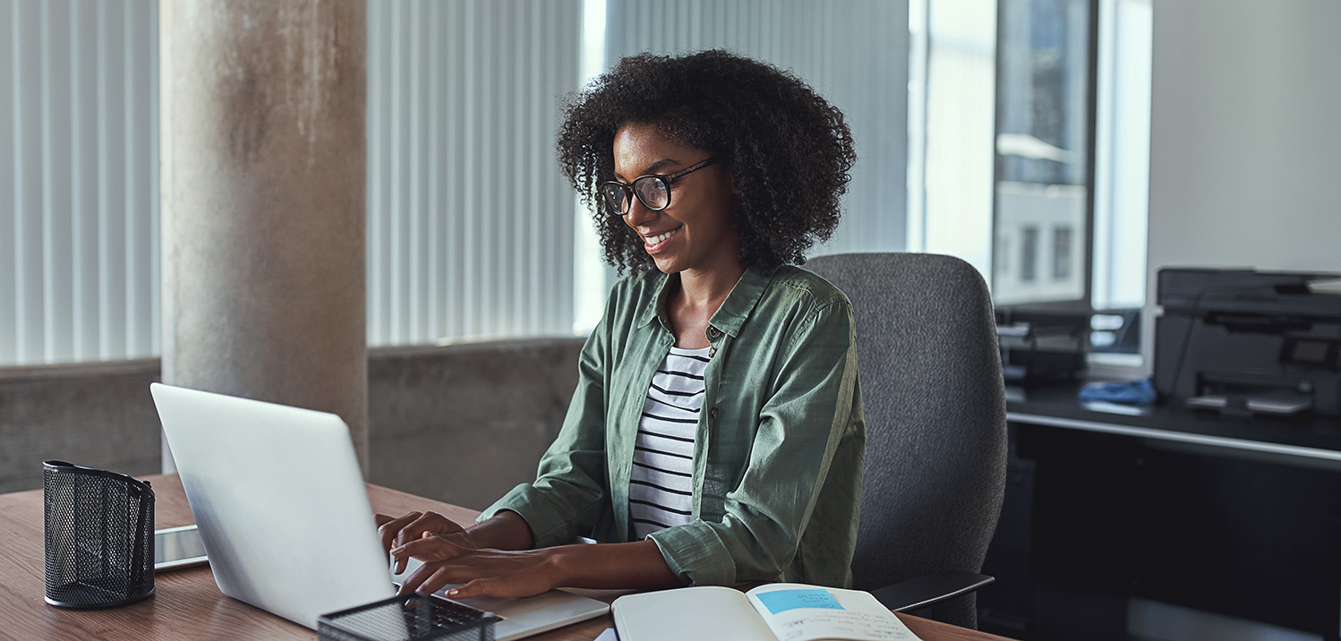 african-american-woman-on-laptop African American woman on laptop smiling