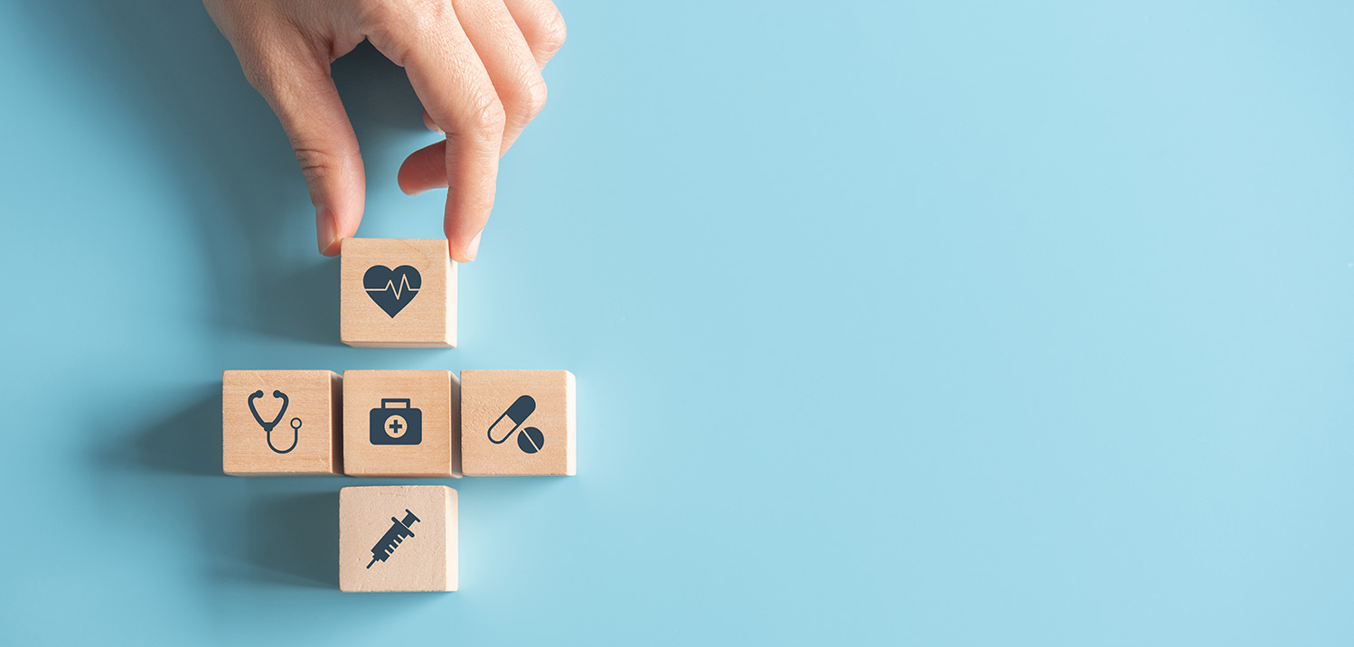 Health plan management illustrated with blocks with icons on them