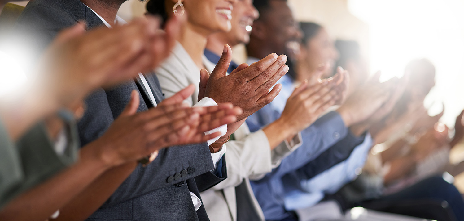 group of people smiling applauding