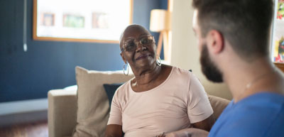 male nurse or aide at home with participant