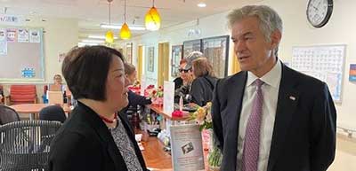 Dr. Oz and Grace Li talking inside an On Lok center