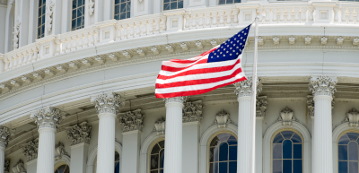 US capitol building close up with American flag