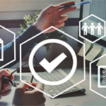 Quality and compliance icons overlayed on photo with two people and a laptop