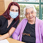 Social worker sitting at table with participant